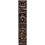 A richly carved wooden panel depicting various gods and goddesses. India, circa 1900.