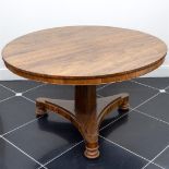 A round mahogany glued stage table, 19th century. veneer damaged.