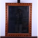 A wall mirror inlaid with various types of wood, mid 19th century.