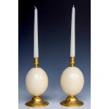 A lot consisting of (2) candlesticks made of copper and ostrich egg, ca, 1900.