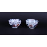 Two porcelain Imari bowls with floral decor under weeping willow. China Qianlong.