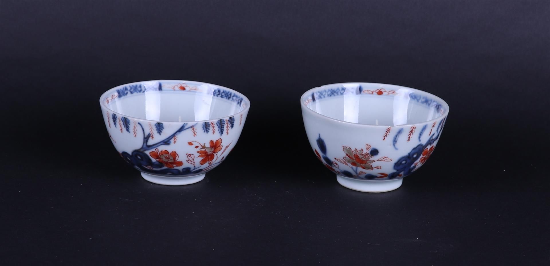 Two porcelain Imari bowls with floral decor under weeping willow. China Qianlong.