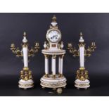 A white marble fireplace set with "gilded" brass frames. France, 20th century.