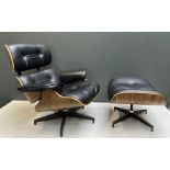 A black leather designer chair with ottoman inspired by Charles & Ray Eames