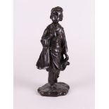 A bronze standing Geisha with gourd in her hand, on a fixed base. Signature on base.