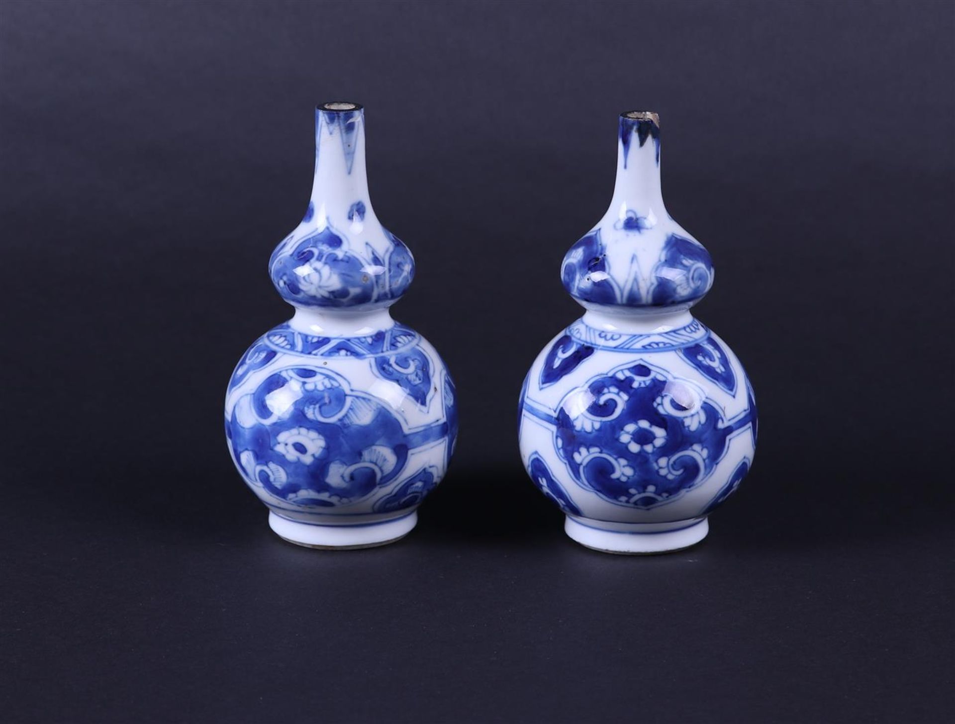 A set of porcelain nodule vases with floral decor in flower beds. China, Kanxi.