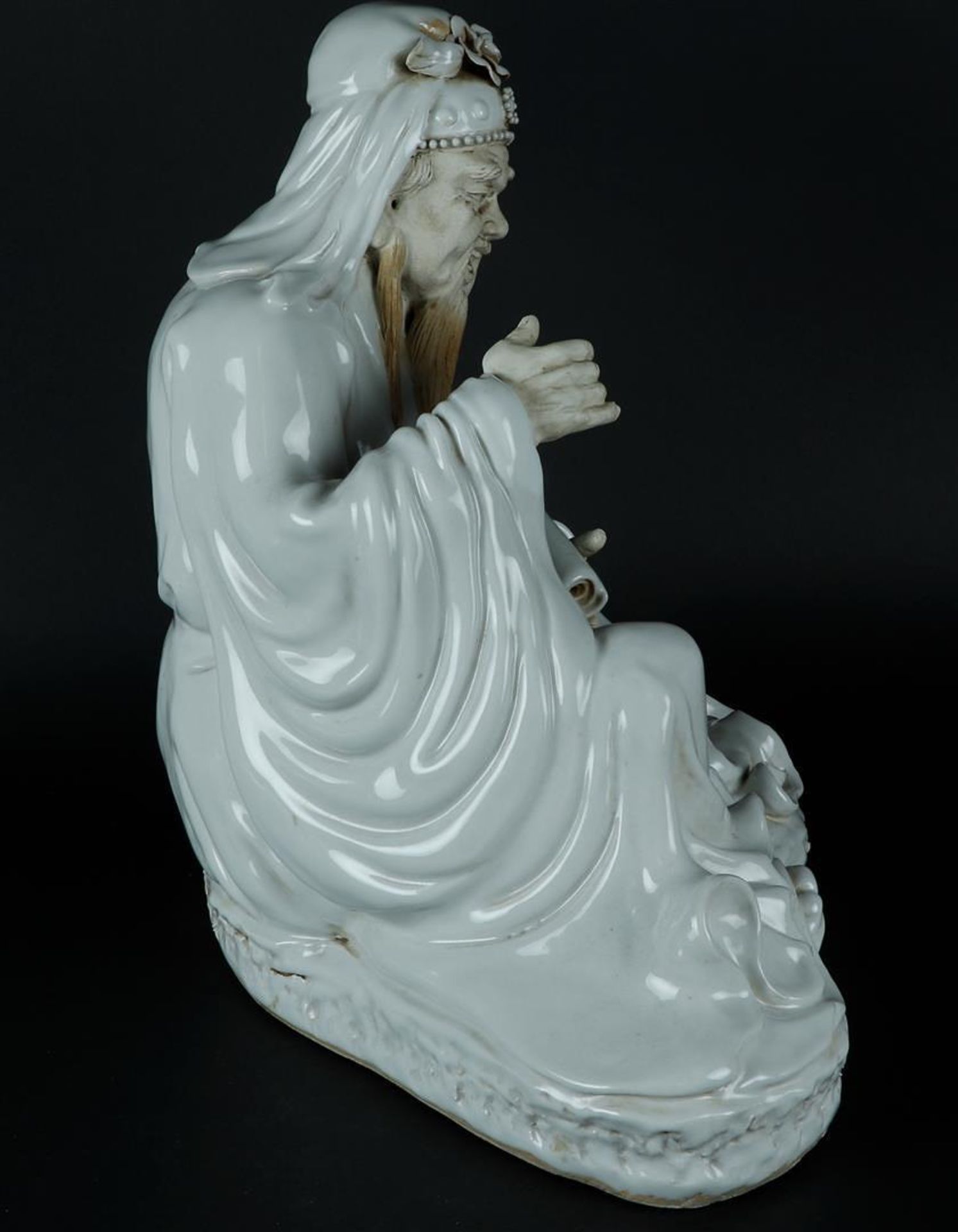 A porcelain Blanc de Chine sage with scroll drawing in hand, hands and face are unglazed. China - Image 3 of 6