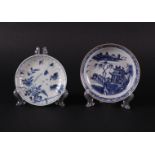 Two different porcelain plates, one with a river landscape, the other with quails.