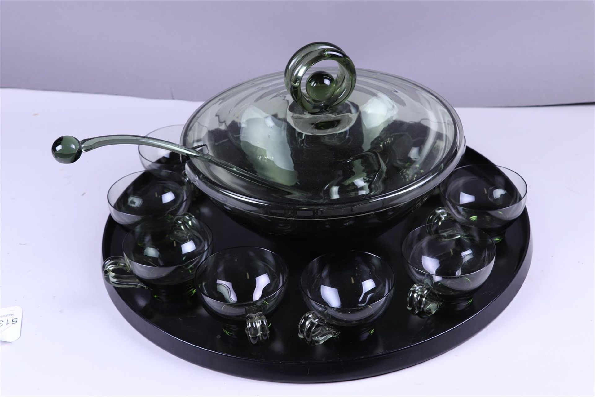 A D Copier  A green glass bowl set consisting of 10 cups, a bowl with spoon and a  bakelite tray.