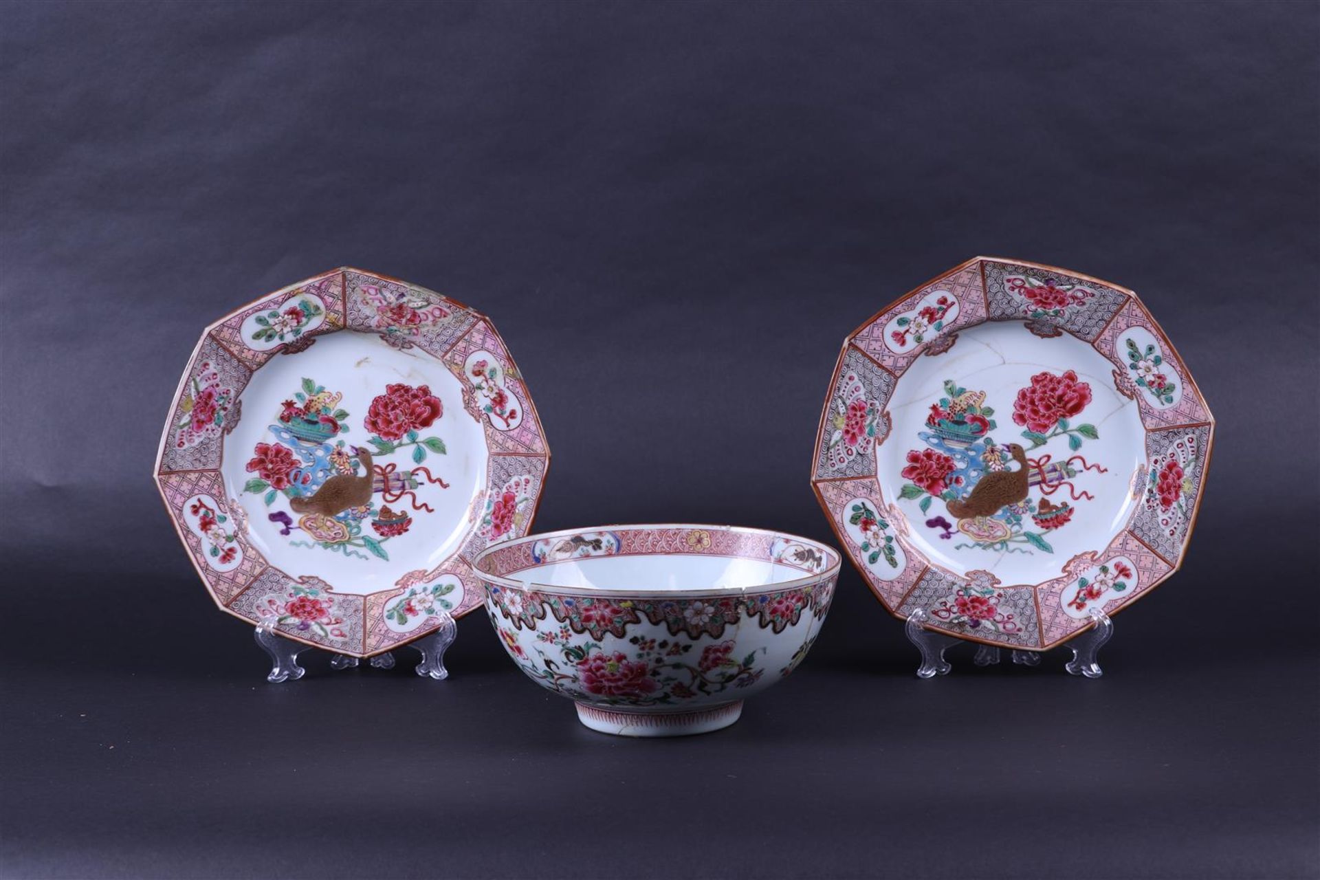 A Famile Rose lot consisting of a bowl and two plates, China, 18th century.