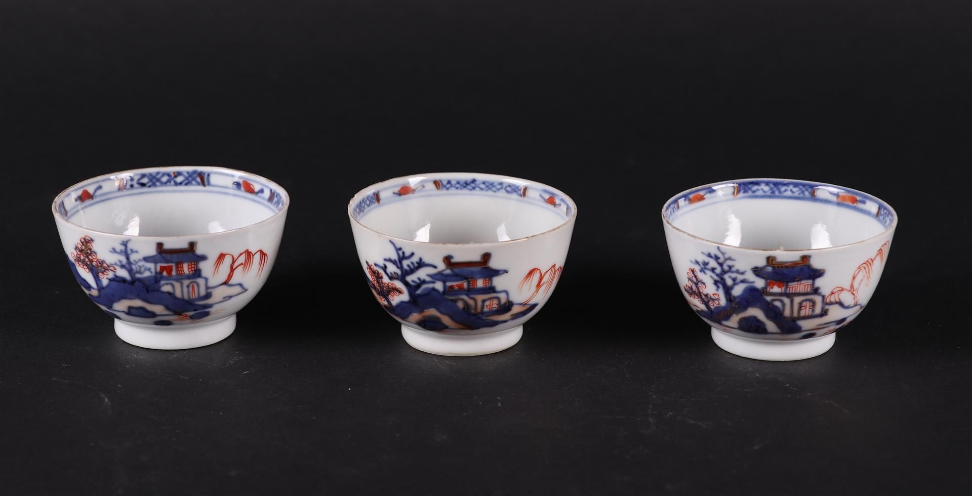 Three porcelain Imari bowls with river landscape decor  and pagoda. China, Qianlong.