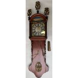 A Dutch Frisian hanging clock with alarm clock and laton copper ornaments. Holland, 19th century.