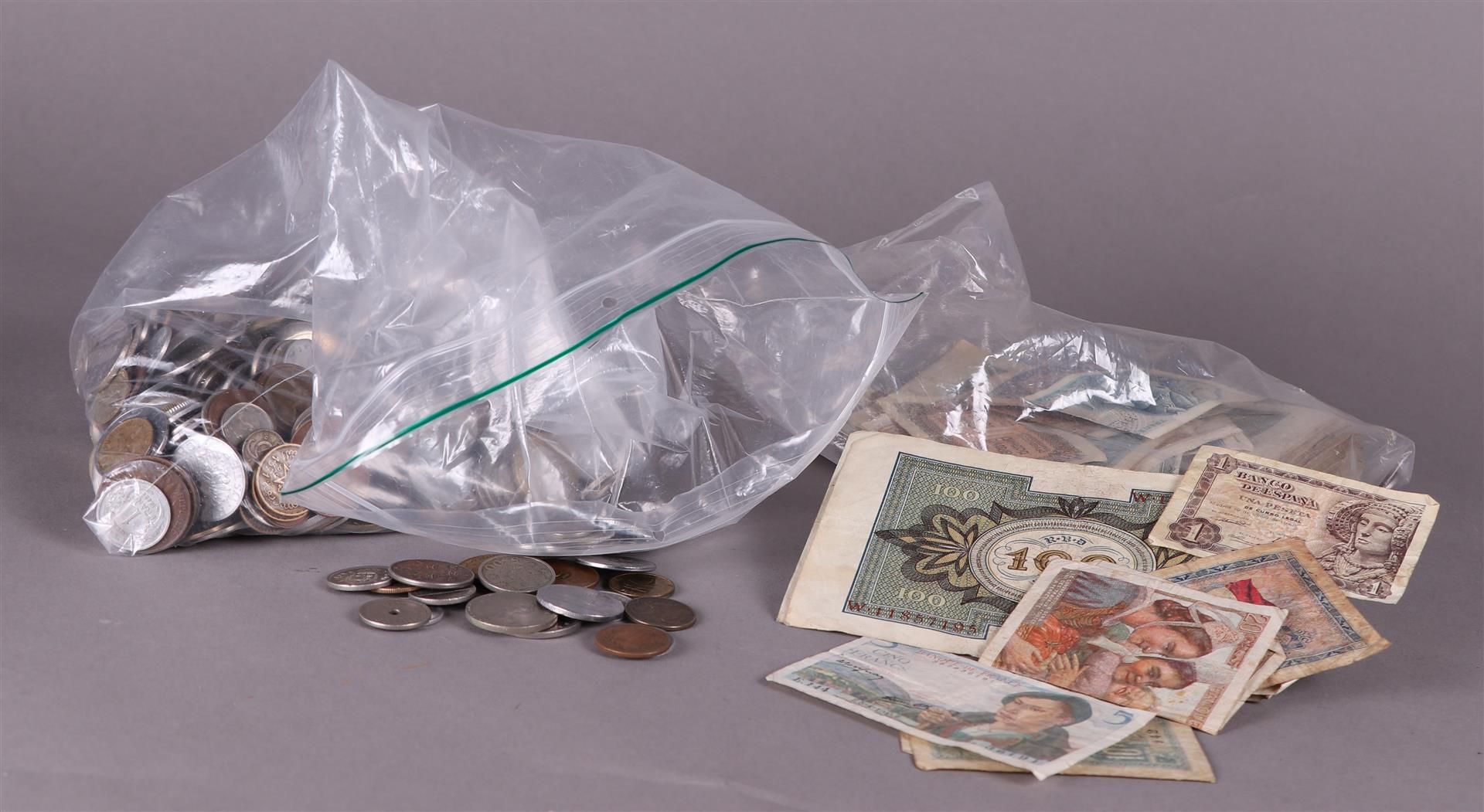 A large lot of banknotes and coins.
