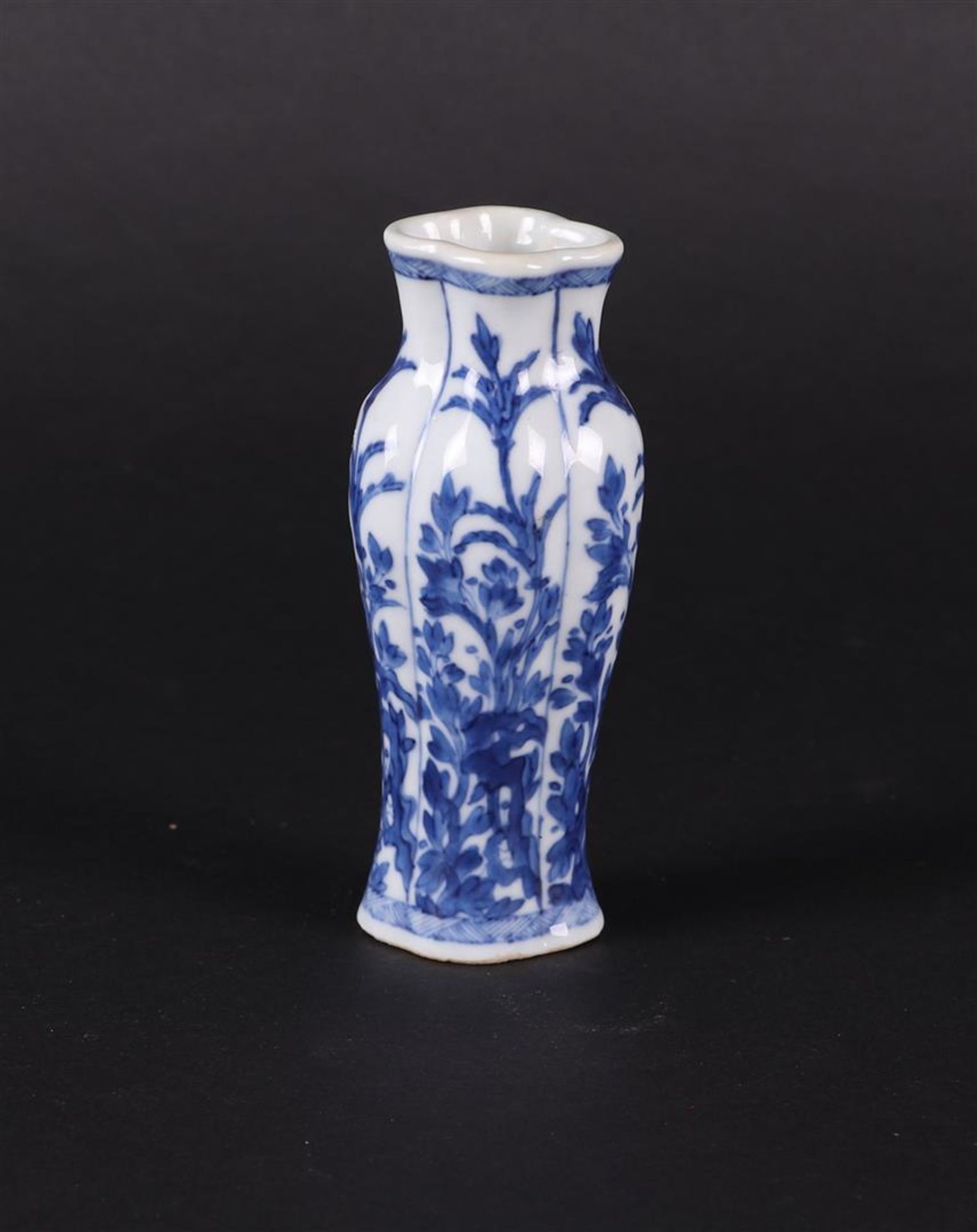 A porcelain shoulder vase 4-pass shaped lobed with rich flower/rock decoration in 4x beds. 