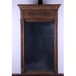 An Empire mirror made of carved lime wood. Approx. 1820. Fitted with the original glass.