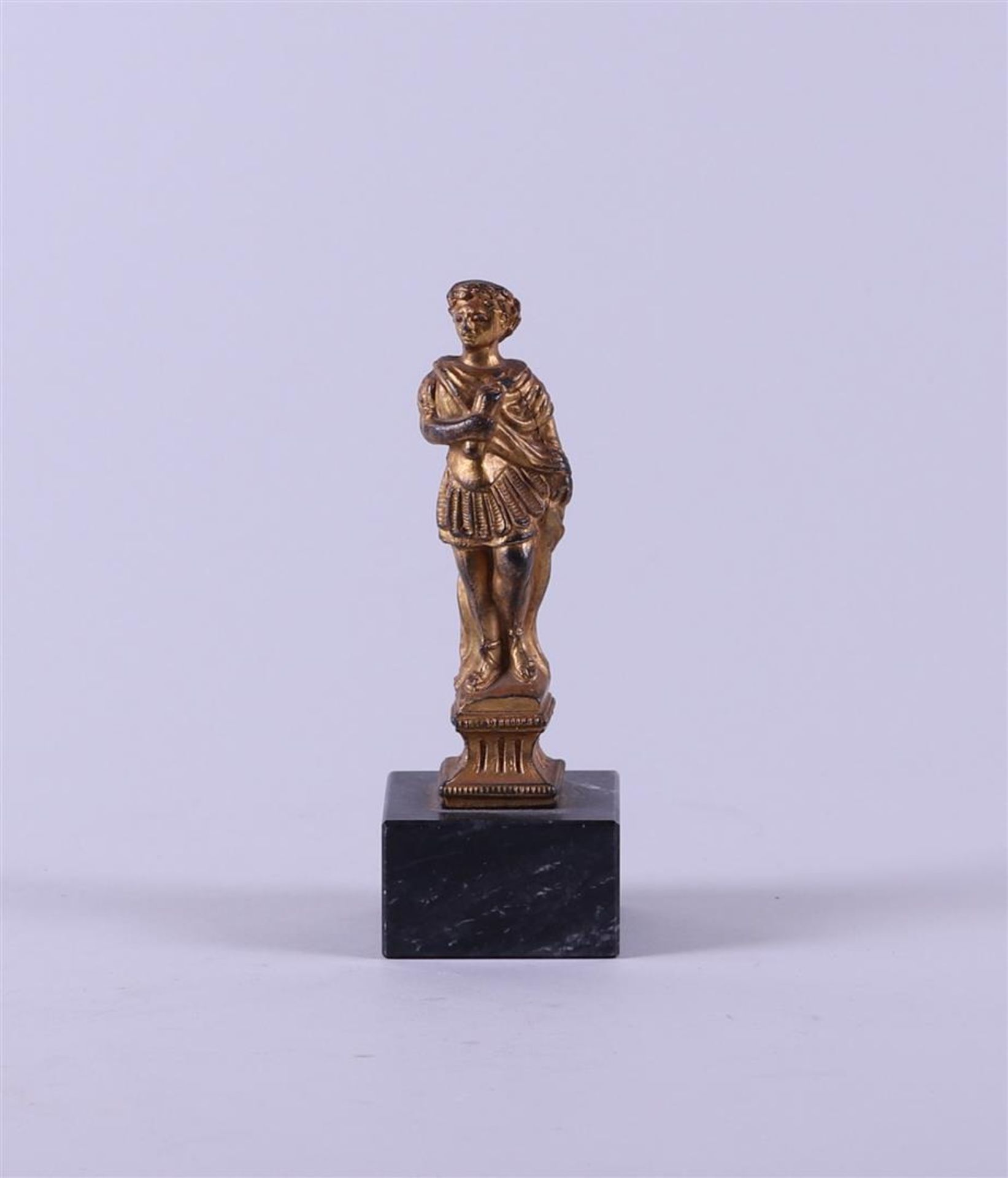 A French patinated bronze desk ornament depicting a Roman emperor.
