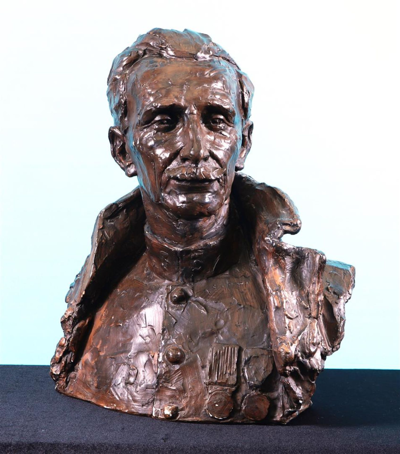 A terra cotta bust of an officer, signed on the back, 