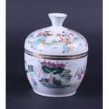 A porcelain Famile Rose lidded pot decorated with various figures. China, 19th century,
