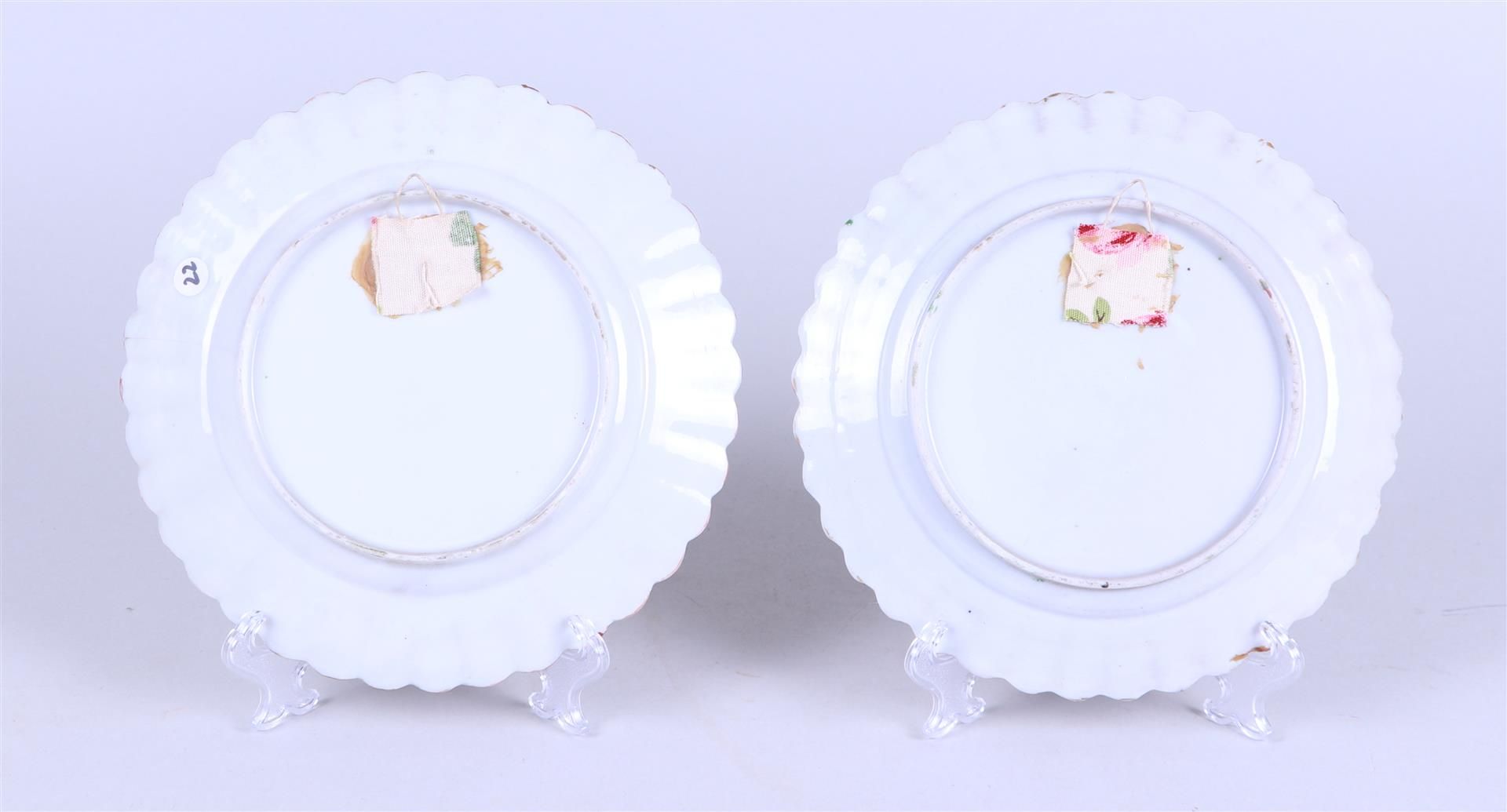 Two porcelain Canton plates with flowerbed decor depicting figures at a pavilion and floral decorati - Image 2 of 2