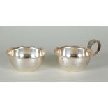 A silver cream set with a lobed edge. Gebr. Huisman, marked with a sword