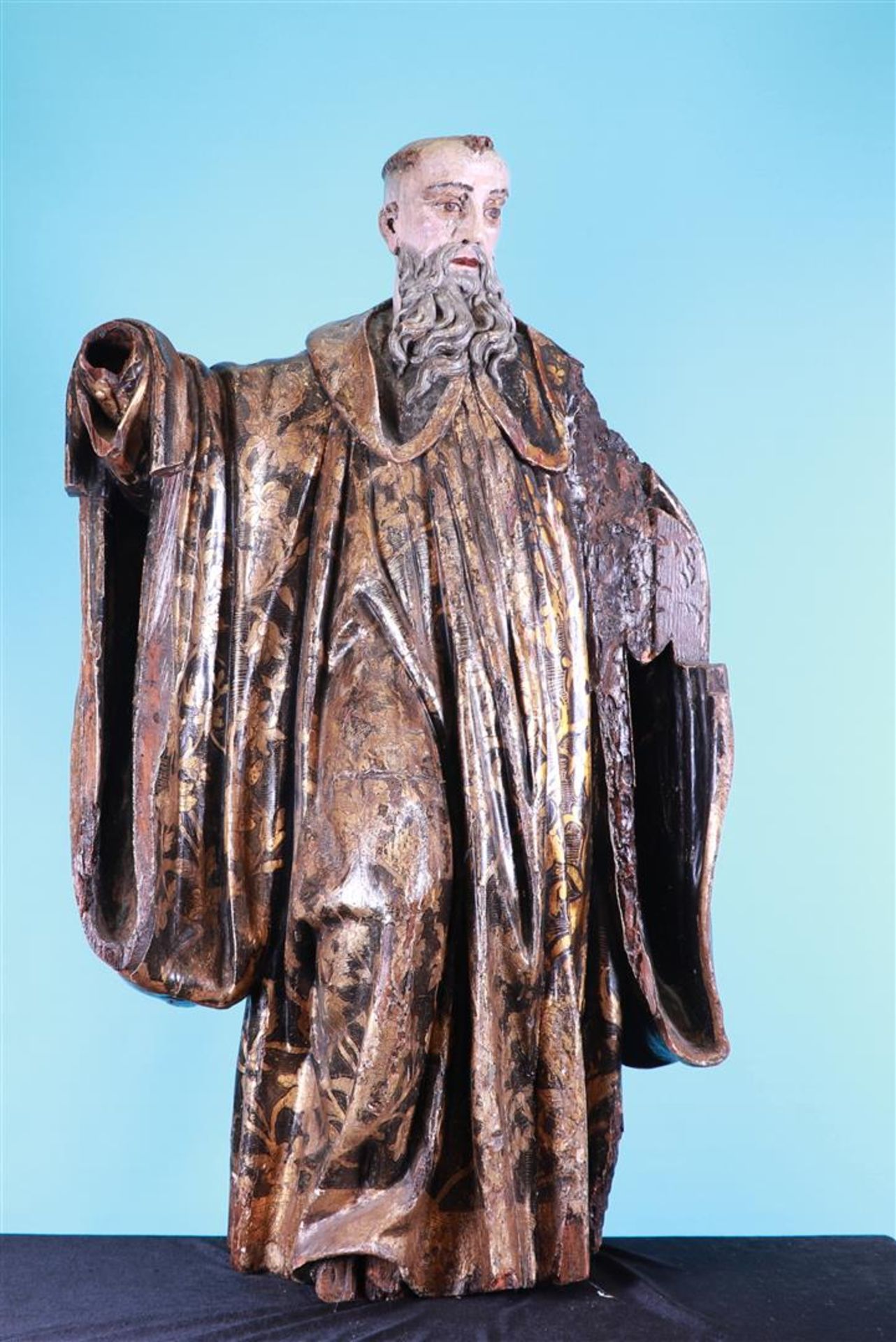 A polychromed and gilded wooden, hollow-carved statue of a Bishop (possibly St. Augustine), ca. 1700