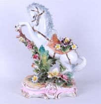 A large earthenware statue of a rearing horse, marked Capodimonte
