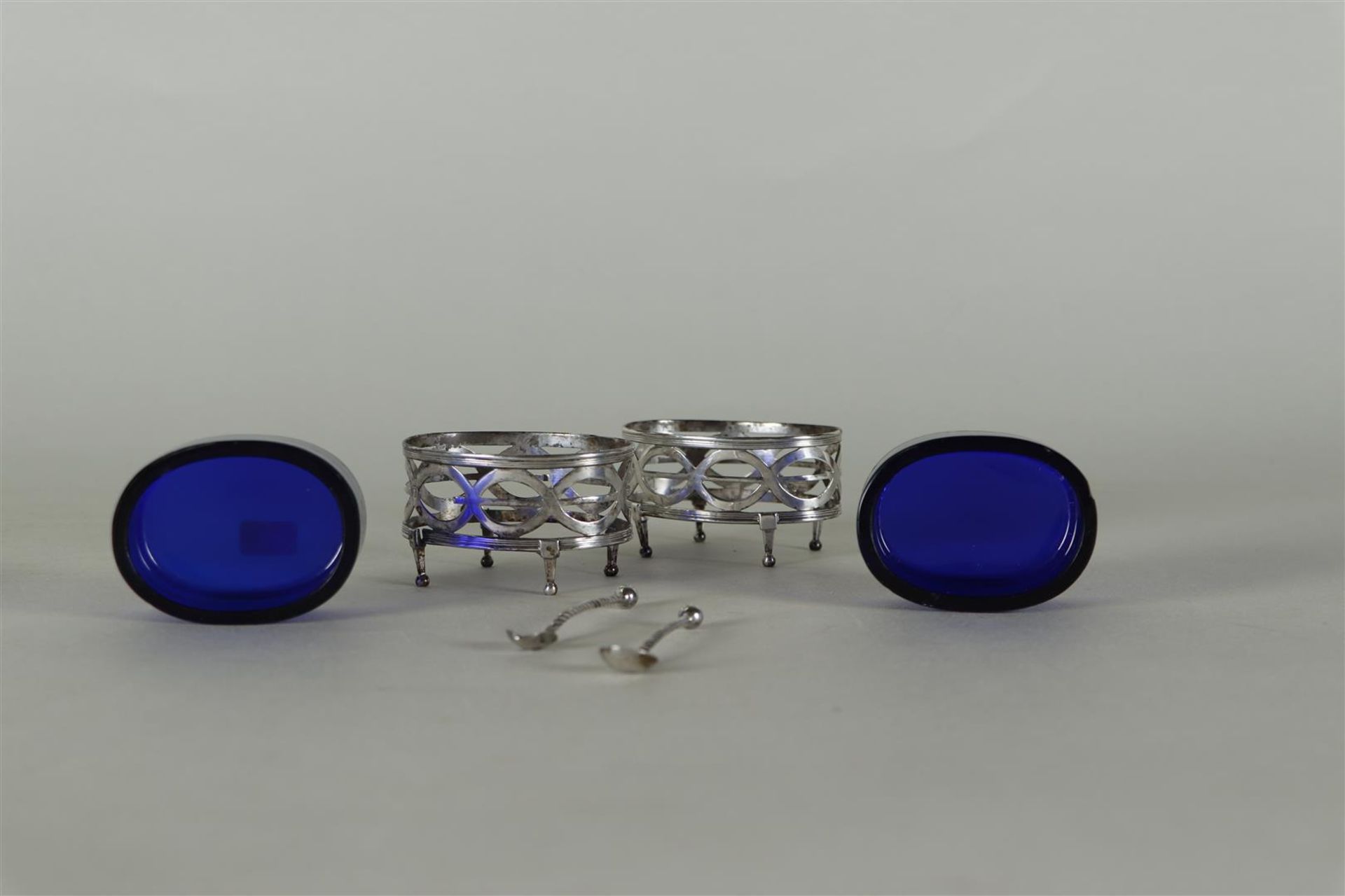 A set of (2) silver Louis XVI salt cellars with blue glass and matching spoons.  - Image 2 of 4