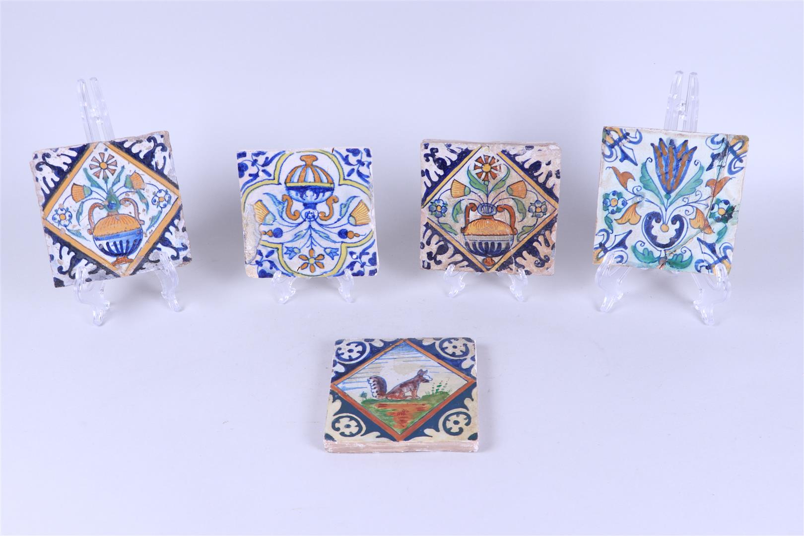 A lot of five polychrome tiles including three square tiles