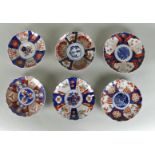 A lot of six Imari plates with flower basket decor and lobed edge. Japan, 19th century.
