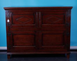 An oak wall unit with wrought iron fittings,