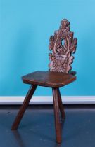 A Dutch/German farm chair with carved backrest.