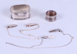 Silver napkin ring, a napkin ring and two napkin clips with chain