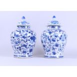 Two porcelain lidded vases with floral decor, base ring at the bottom. China, 19th century.
