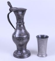 A tin lot consisting of a bridal cup and a city jug, 19th century.
