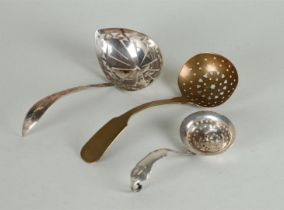 A lot consisting of two silver and one copper spoons.