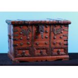 A soft wooden valuables box with copper fittings and three drawers with secret locks