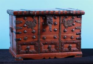 A soft wooden valuables box with copper fittings and three drawers with secret locks