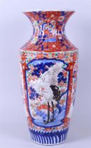 An Imari baluster vase with a raised decor of herons. Japan, 19th century.