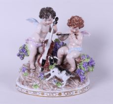 A porcelain group depicting two putti playing music, marked Sitzendorf