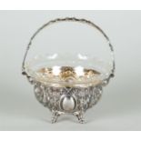 A cut glass chocolate dish in Neo Renaissance silver frame. Unclearly marked on the handle