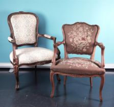 A lot consisting of (2) various Louis XV style armchairs, both upholstered with an embroidered seat 