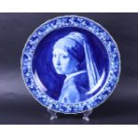 A large earthenware wall dish with an image after Vermeer 'Girl with a pearl earring'. Delft porcela