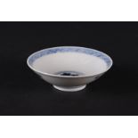 A porcelain bowl with a floral decor in the center, the outer rim with grid work, marked with the 6-