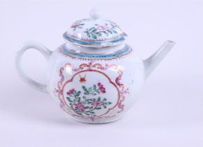 A porcelain Famille Rose teapot with rich floral decoration in the bed. China, Qianlong.