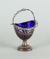A silver openwork sugar basket with blue glass inner container and with openwork edge for 12 silver 