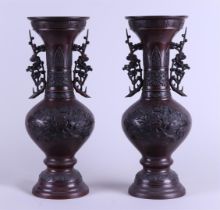 A set of two bronze vases decorated with flowers and birds. Japan, Meiji period.