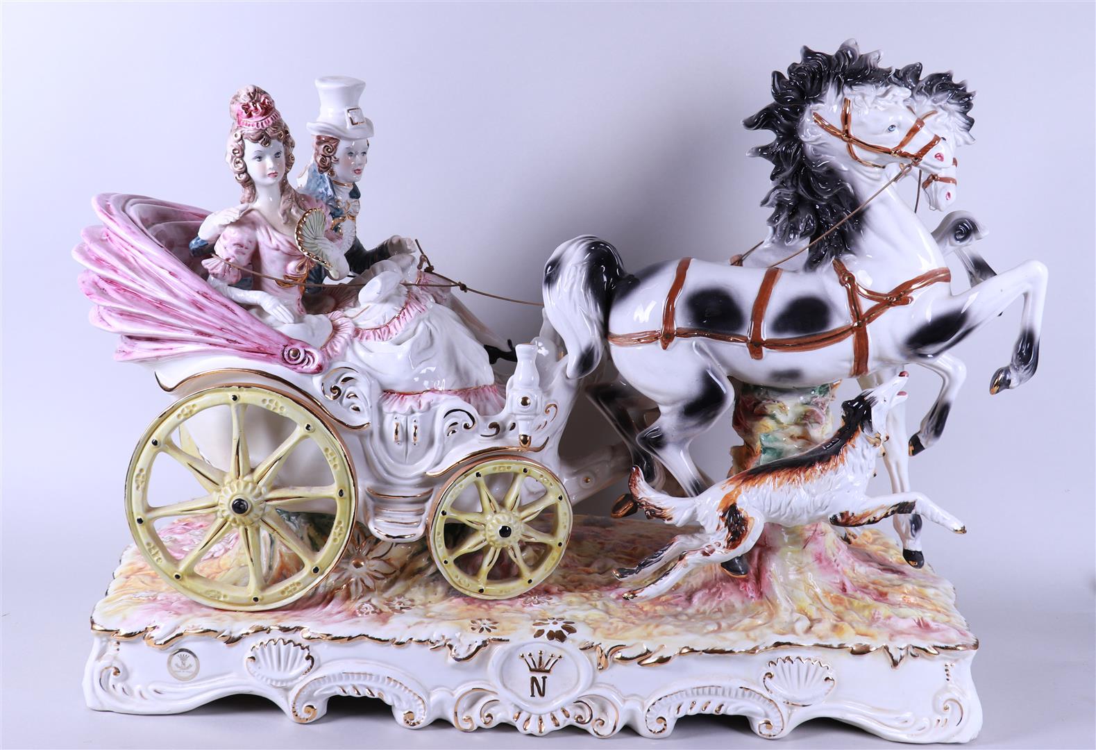 A very large earthenware statue of a carriage with horses, marked Capodimonte