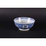 A porcelain bowl with a lotus leaf outer rim, filled with floral decor, the center decorated with po