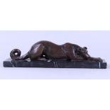 An Art Deco-style sculpture of a greyhound dog on a marble base.
