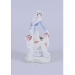 A porcelain figure of a lady with two dogs 'Daisy', Royal Doulton.
